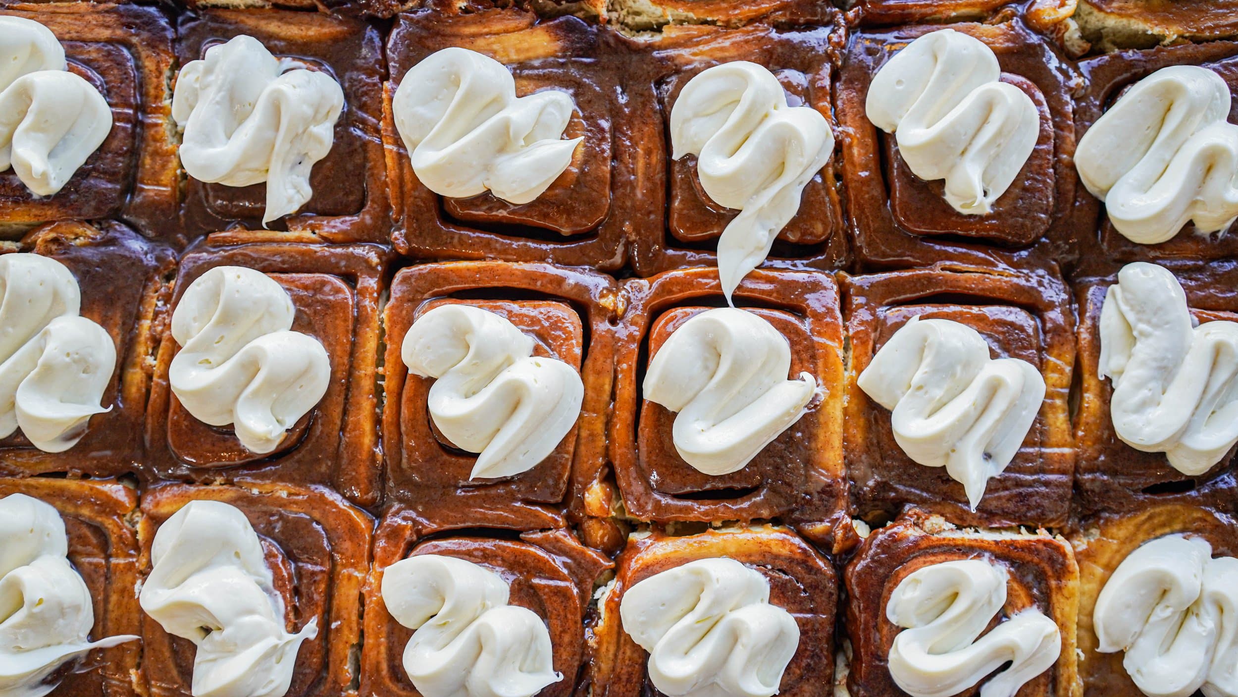Birdseye view of fresh cinnamon buns at Le Croissant